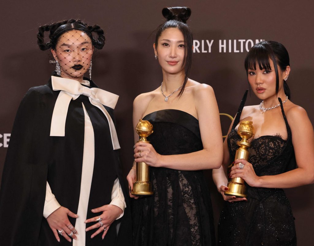(L/R) US singer Audrey Nuna, South Korean-US singer EJAE and South Korean singer Rei Ami, winners of the Best Original Song - Motion Picture for "Golden" from "KPop Demon Hunters," pose in the press room during the 83rd annual Golden Globe Awards at the Beverly Hilton hotel in Beverly Hills, California, on January 11, 2026. (Photo by Etienne Laurent / AFP) / -- IMAGE RESTRICTED TO EDITORIAL USE - STRICTLY NO COMMERCIAL USE --/2026-01-12 13:05:48/